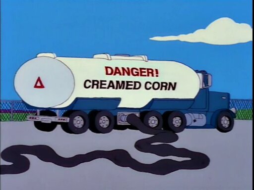 Cartoon tanker truck emblazoned 'Danger! Creamed Corn' with a large hose attached that appears to be in use.